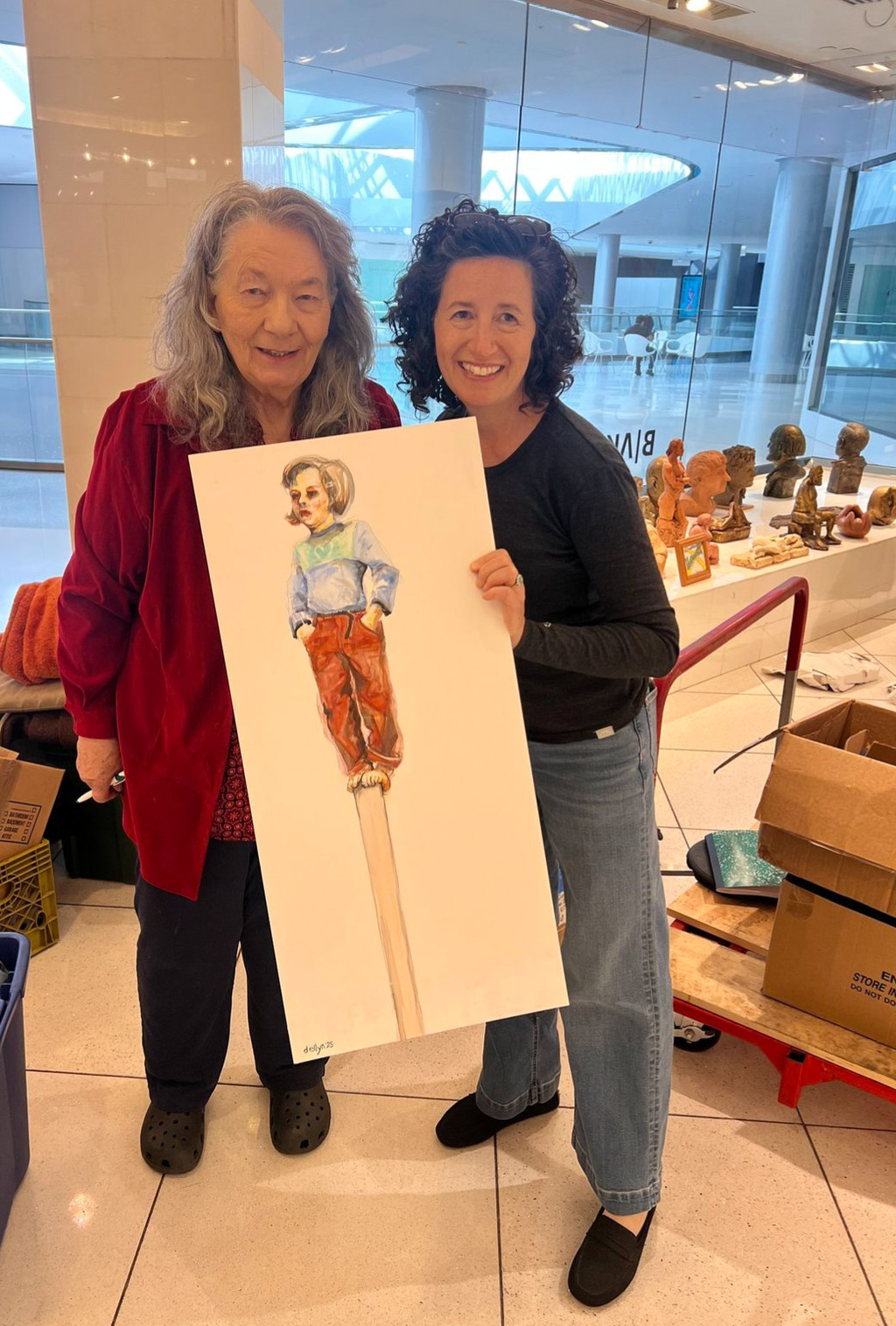 Dana Ellyn with Linda King along with Ellyn's painting of Linda King as a child.